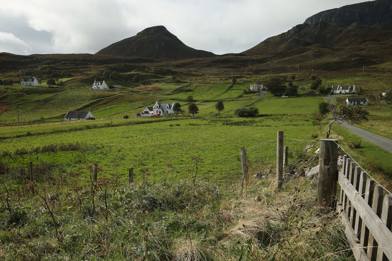 Traditional white Scottish farmhouses, here pictured near The Quiraing in Staffin, Isle of Skye.