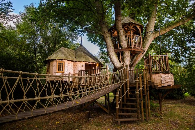 This two-level timber hideaway is nestled within the branches of a mature oak tree.