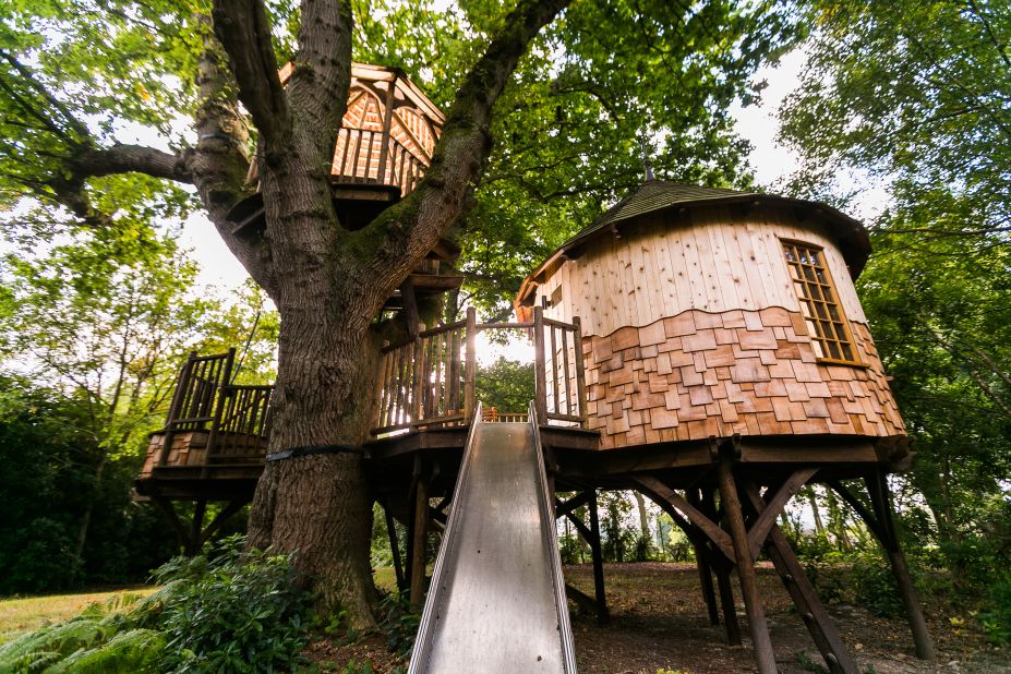 "Timbertop Hangout Treehouse" is fitted with a crow's nest lookout raised high above, and a stainless steel slide. 