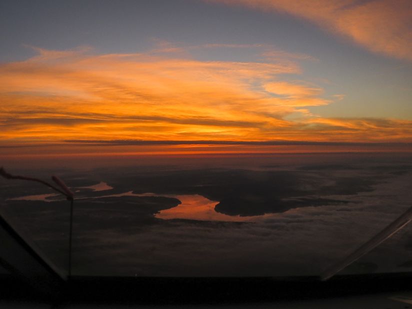 A dramatic sunset is seen over the Mississippi river on the voyage across the United States from Tulsa, Oklahoma, to Dayton, Ohio.