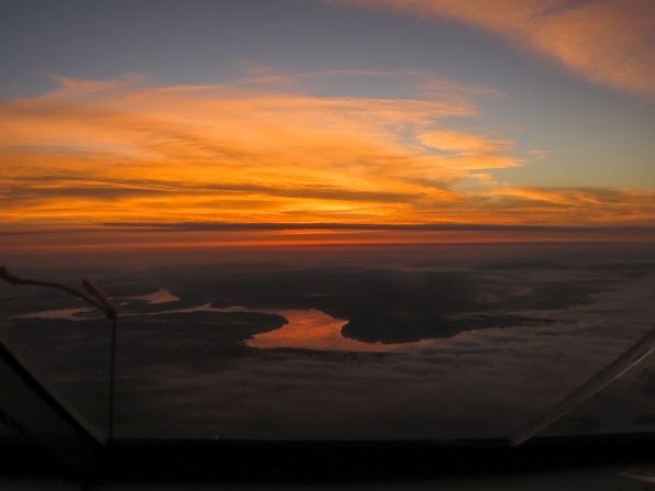 A dramatic sunset is seen over the Mississippi river on the voyage across the United States from Tulsa, Oklahoma, to Dayton, Ohio.