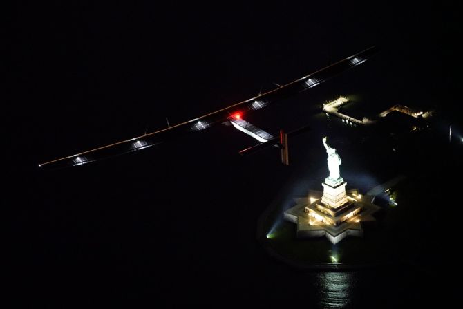 The plane crosses over the Statue of Liberty in New York, the final leg in the United States.