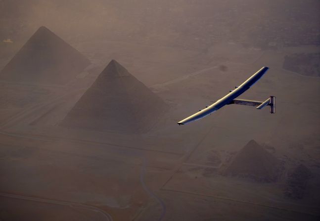 Just under two weeks away from completing the journey in Abu Dhabi, the plane is seen passing over the iconic pyramids in Egypt.