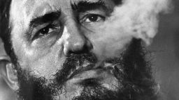 FILE - In this March 1985 file photo, Cuban Prime Minister Fidel Castro exhales cigar smoke during an interview at his presidential palace in Havana, Cuba. Castro, a Havana attorney who fought for the poor, overthrew dictator Fulgencio Batista's government on Jan. 1, 1959. As Castro turns 90 on Aug. 13, 2016, it's an uncertain time, with no settled consensus around his legacy. The government and its backers laud Castro's nationalism and his construction of a social safety net that provided free housing, education and health care to every Cuban. Less is said about decades of economic stewardship that, along with a U.S. trade embargo, has left Cuba's infrastructure and its economy cash-strapped and still dependent on billions in aid from abroad. (AP Photo/ Charles Tasnadi, File)
