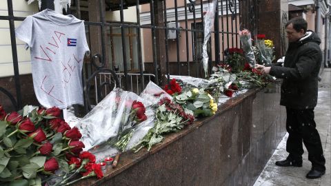 A man places flowers at the Cuban Embassy in Moscow in memory of Castro on November 26. Russian President Vladimir Putin called the Cuban leader "a sincere and reliable friend of Russia." 