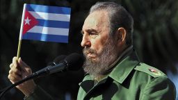 Cuban President Fidel Castro waves a flag during a visit on January 27, 2001 to the Havana neighborhood of San Jose de las Lajas. Castro died on Friday, November 25, 2016 at age 90. 