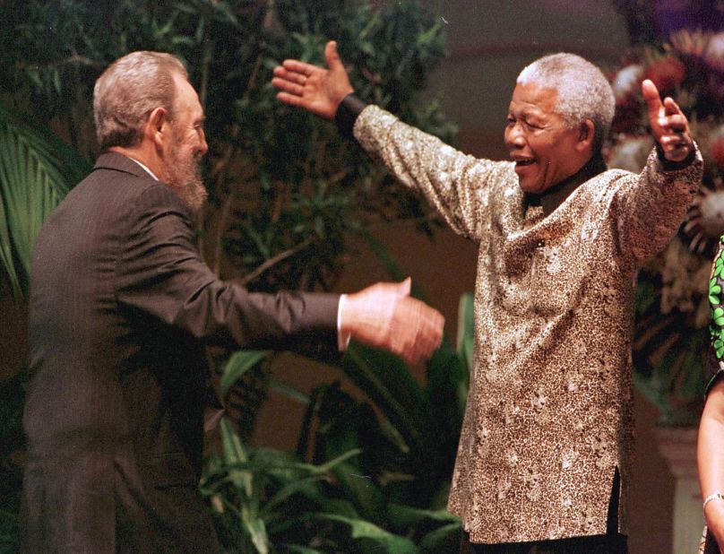 South African President Nelson Mandela greets Cuban leader Fidel Castro as he arrives for the opening of the 12th Non-Aligned Movement summit in Durban on September 2, 1998