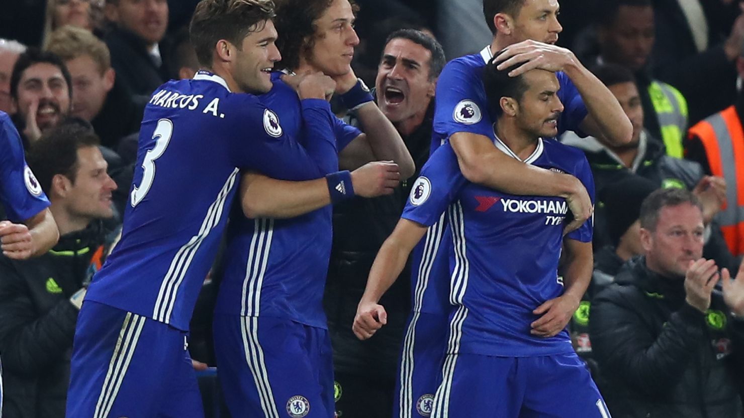 Pedro (far right) is congratulated after scoring his team's first goal in the 2-1 win over Tottenham Hotspur at Stamford Bridge.

