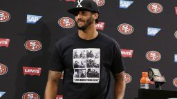 San Francisco 49ers quarterback Colin Kaepernick leaves a podium after speaking with reporters following an NFL preseason football game against the Green Bay Packers Friday, August. 26, 2016, in Santa Clara, California. 