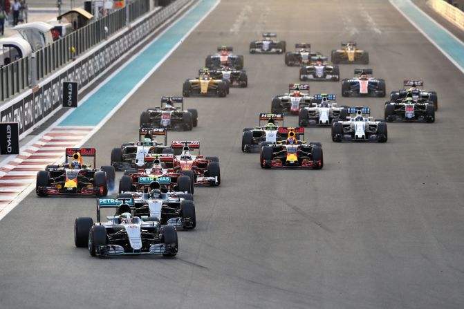 Lewis Hamilton leads from Mercedes teammate Nico Rosberg heading into the first corner at the start of the Abu Dhabi Grand Prix. 