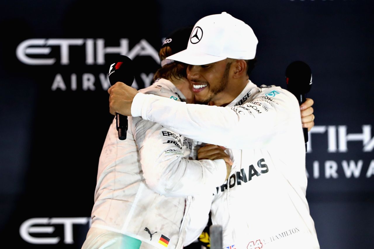 Rosberg and Hamilton embrace on the podium -- hostilities over for another season. 