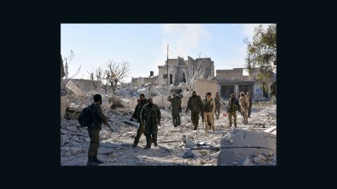 Syrian pro-government forces in the Masaken Hanano district in eastern Aleppo on Sunday as regime forces seized it from rebels, in this photo from the Rumaf Syrian-Kurdish activist group.