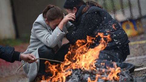 Relatives of workers killed in the platform collapse grieve outside the complex in China's Jiangxi province, November 26, 2016.