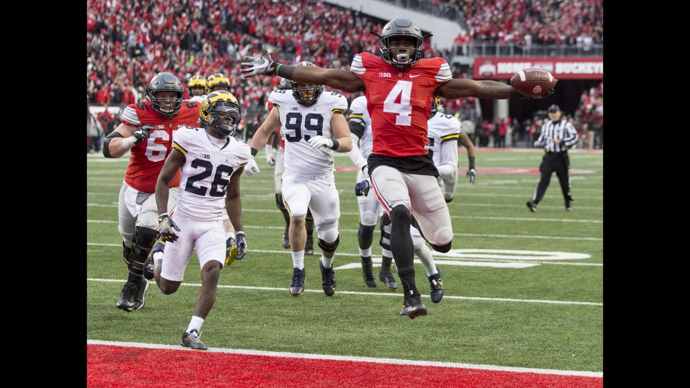 Ohio State running back Curtis Samuel scores a touchdown in double overtime to beat Michigan on Saturday, November 26. The rival teams came into the game ranked 2 and 3 by the College Football Playoff committee. 