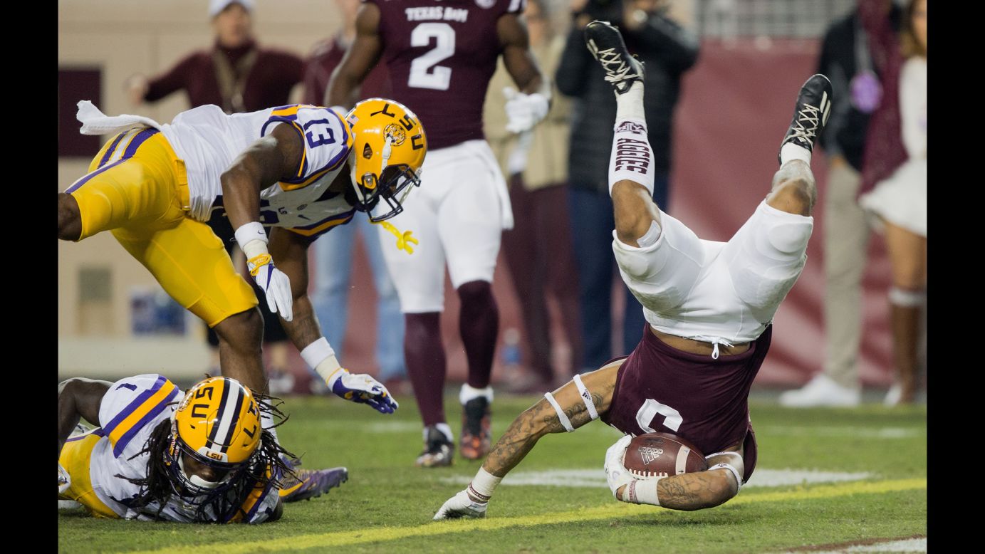 Texas A&M running back Trayveon Williams flips over the goal line, scoring a touchdown against LSU on Thursday, November 24. LSU won the Thanksgiving matchup 54-39.