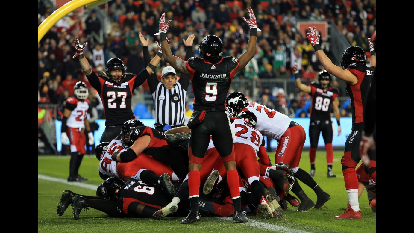 Ottawa players celebrate a second-half touchdown during their Grey Cup victory on Sunday, November 27. Ottawa defeated Calgary 39-33 in overtime for the city's first CFL title since 1976.
