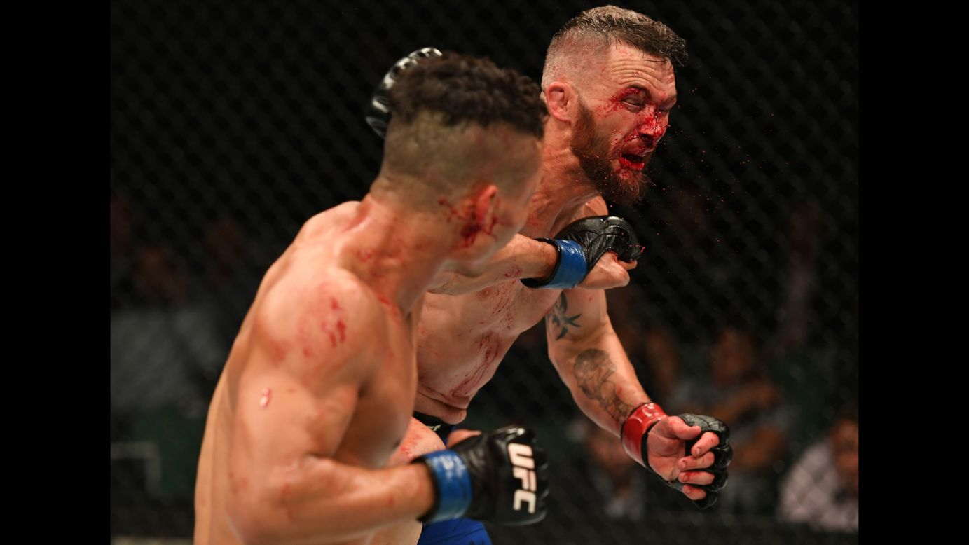 Jon Tuck punches Damien Brown during their UFC lightweight bout in Melbourne on Sunday, November 27. Brown won by split decision.