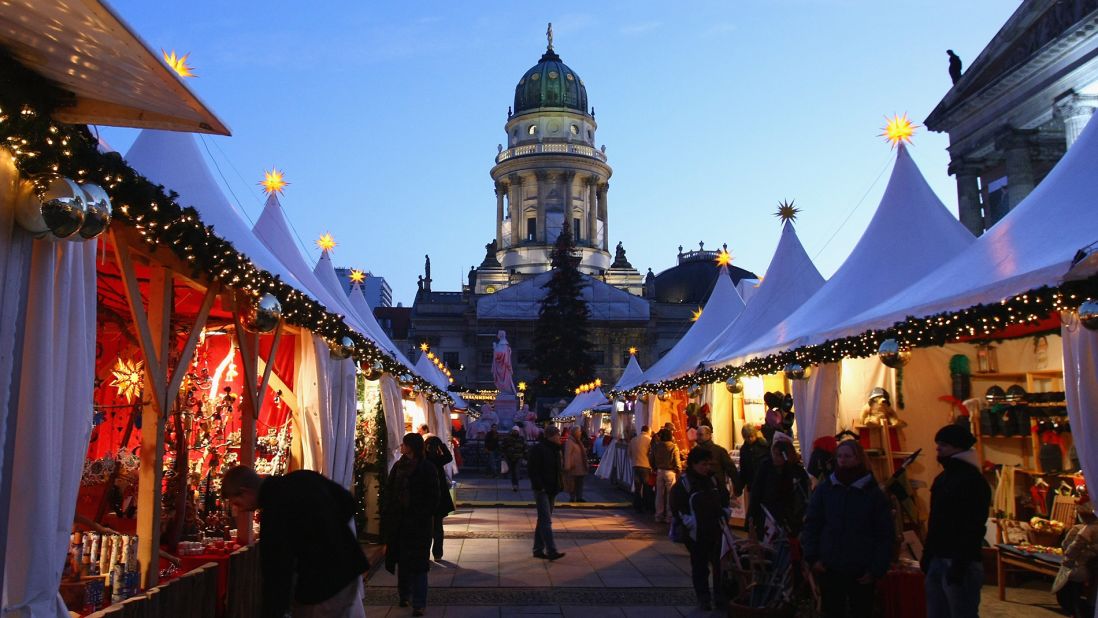 <strong>December in Germany:</strong> People walk through the annual Christmas market at Gendarmenmarkt square in Berlin.