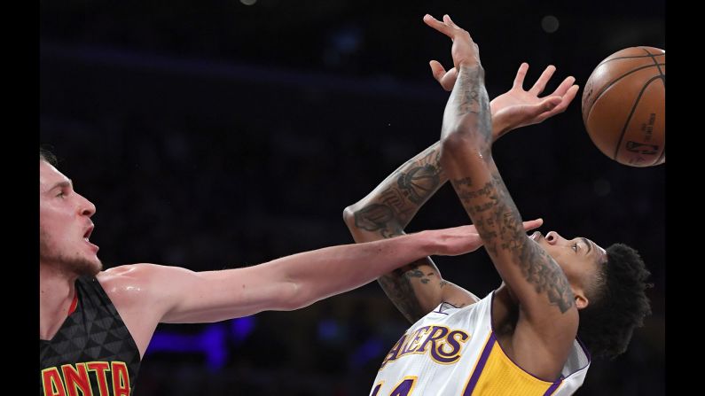 Atlanta's Mike Muscala blocks Brandon Ingram's shot during an NBA game in Los Angeles on Sunday, November 27.