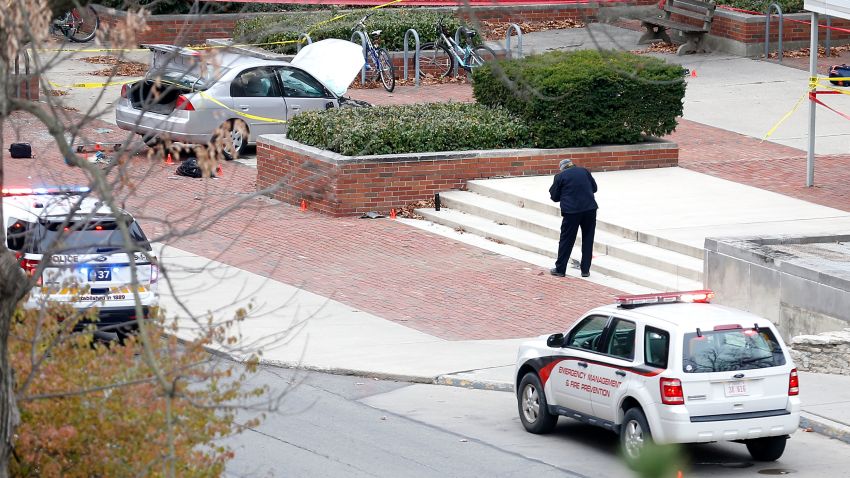 COLUMBUS, OH - NOVEMBER 28: Police investigate the scene where an individual used a car to crash into a group of students outside of Watts Hall on the Ohio State University campus on November 28, 2016 in Columbus, Ohio. At least nine people were injured when a suspect reportedly drove into a crowd of pedestrians and slashed several people with a knife before being fatally shot by university police. (Photo by Kirk Irwin/Getty Images)