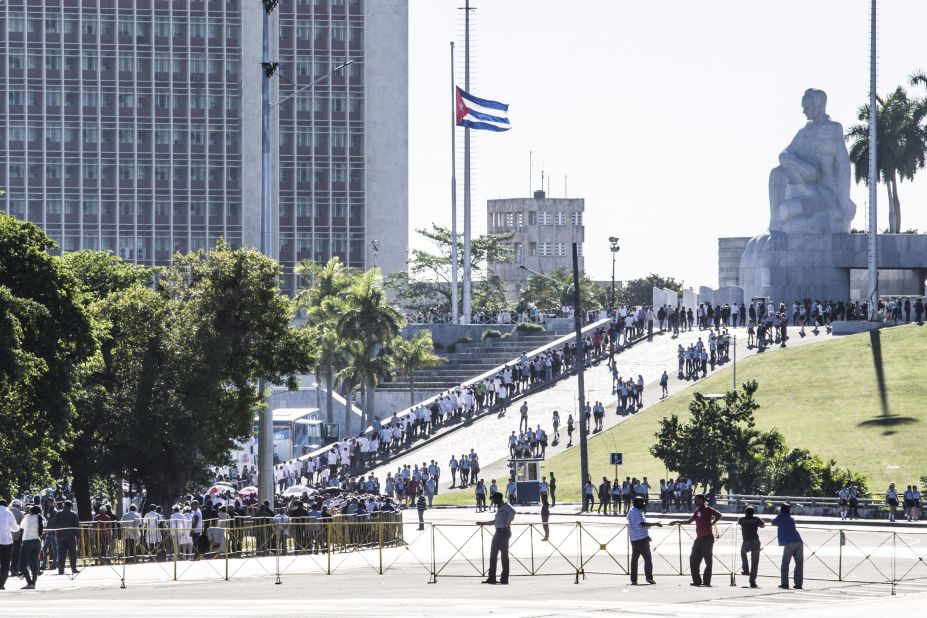 People gather at Revolution Square to pay tribute to Castro on Monday, November 28. 