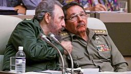 HAVANA, CUBA:  (FILE) Picture taken 20 December 1999, in Havana of Cuban President Fidel Castro (L) speaking with his brother ad Armed Forces Minister Raul Castro during the IV Working Session of the National Assembly. A spokesman of Cuban President Fidel Castro read on Cuban National TV a document signed by him, 31 July 2006, by which he delegates power to his brother Raul Castro. Fidel Castro underwent surgery shortly after coming back from Mercosur?s Summit in Cordoba, Argentina. "I do delegate, provisionally, my duties as first secretary of the Central Committee of the Communist Party in Cuba, to the second secretary, comrade Raul Castro Ruz," Castro said. (ELECTRONIC IMAGE)   AFP PHOTO/ADALBERTO ROQUE  (Photo credit should read ADALBERTO ROQUE/AFP/Getty Images)