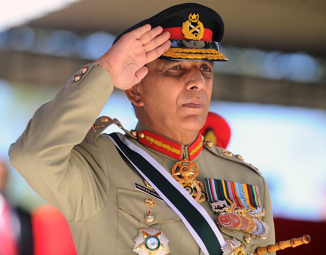 Former Pakistani Army Chief General Ashfaq Parvez Kayani salutes a guard of honor as chief guest during a graduation ceremony for some 64 Sri Lankan army officers in the island nation's central district town of Diyatalawa on June 29, 2013.