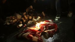 NEW YORK, NY - NOVEMBER 9: Protestors burn an American flag on Fifth Avenue outside of Trump Tower, November 9, 2016 in New York City. Republican candidate Donald Trump won the 2016 presidential election in the early hours of the morning in a widely unforeseen upset.
