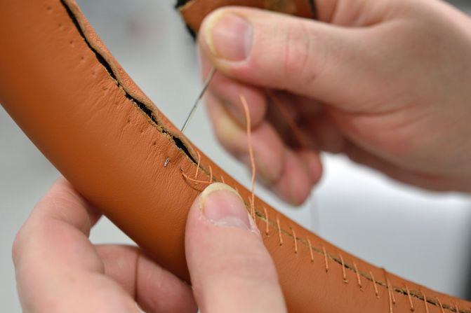 Hand-stitched leather steering wheels offer a softer feel in the hand than items stitched by machines.