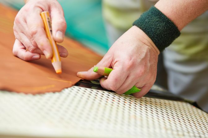 For all the investment, mark-up of Bentley's leather hides still relies on specially trained technicians.