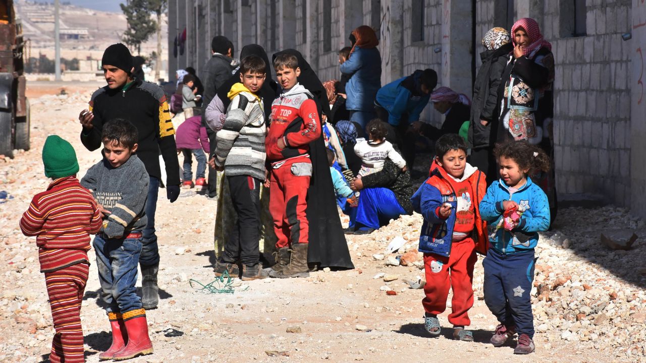 Displaced Syrian families at a camp in government-held Jibreen in Aleppo on Sunday.