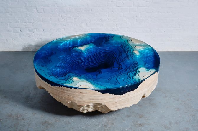 Known for designs that play with the concepts of gravity, geography and illusion, London-based designer Christopher Duffy presents his Abyss Round Table with Sarah Myerscough Gallery at Design Miami this year. Inspired by the depths of the ocean, the table is crafted from wood and glass, arranged like a 3D representation of a geological map. 