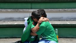 People cry during a tribute to the players of Brazilian team Chapecoense Real who were killed in a plane accident in the Colombian mountains, at the club's Arena Conda stadium in Chapeco, in the southern Brazilian state of Santa Catarina, on November 29, 2016.
Players of the Chapecoense were among 81 people on board the doomed flight that crashed into mountains in northwestern Colombia, in which officials said just six people were thought to have survived, including three of the players. Chapecoense had risen from obscurity to make it to the Copa Sudamericana finals scheduled for Wednesday against Atletico Nacional of Colombia.
 / AFP / Nelson ALMEIDA        (Photo credit should read NELSON ALMEIDA/AFP/Getty Images)