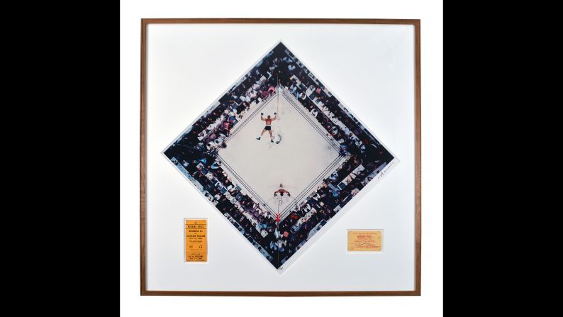 This memorable photo, taken by acclaimed sports photographer Neil Leifer, shows Muhammad Ali raising his arms after knocking out Cleveland "Big Cat" Williams in 1966. It is framed with Leifer's press pass from the fight. Leifer's personal collection, which also includes images from other great photographers, <a href="index.php?page=&url=https%3A%2F%2Fwww.guernseys.com%2Fv2%2Fleifer.html" target="_blank" target="_blank">will be on auction</a> December 2-3 in New York. "This is my favorite photograph," Leifer told CNN's Lawrence Crook III. "It's the only picture I've taken ever in my life that, when I look at it even 50 years later ... there isn't a single thing I would change."