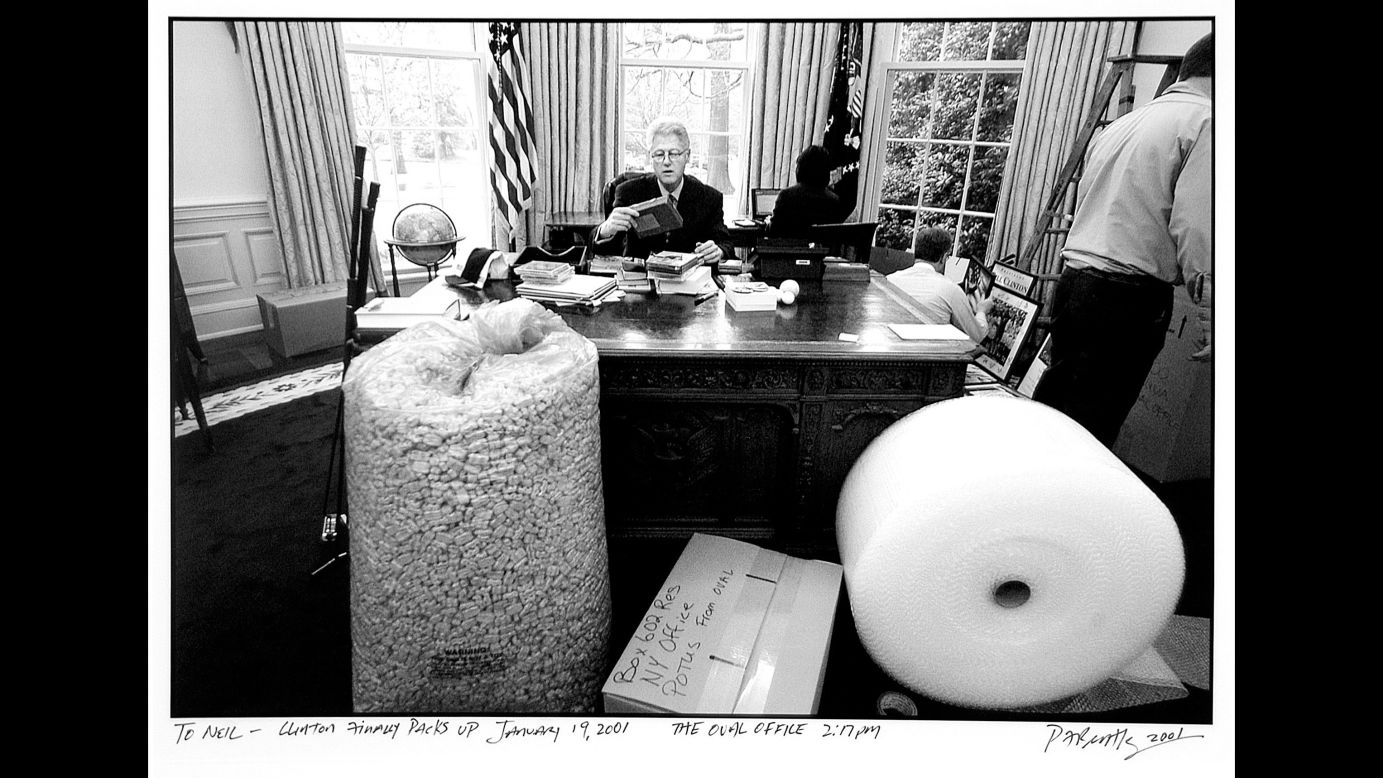 US President Bill Clinton is photographed by P.F. Bentley as he spends one of his final moments in the White House Oval Office in 2001.