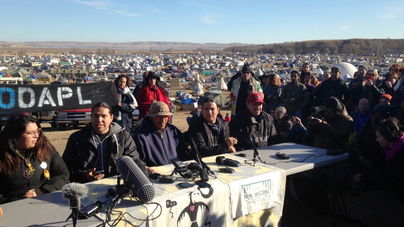 People against the construction of the Dakota Access Pipeline speak at a news conference near Cannon Ball on Saturday, November 26.
