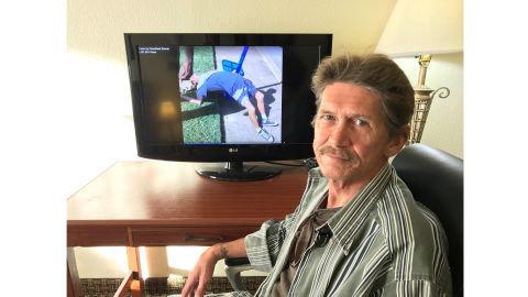 Ronald Hiers watches the video of himself and his wife overdosing on heroin.