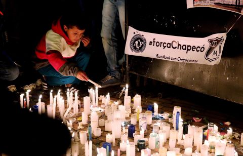 People attend a candlelight vigil in Bogota, Colombia, on November 29.