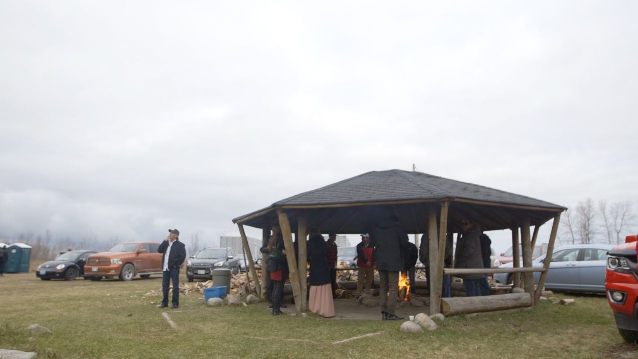 Guests gather at the sacred fire during a break at the Turtle Lodge gathering.