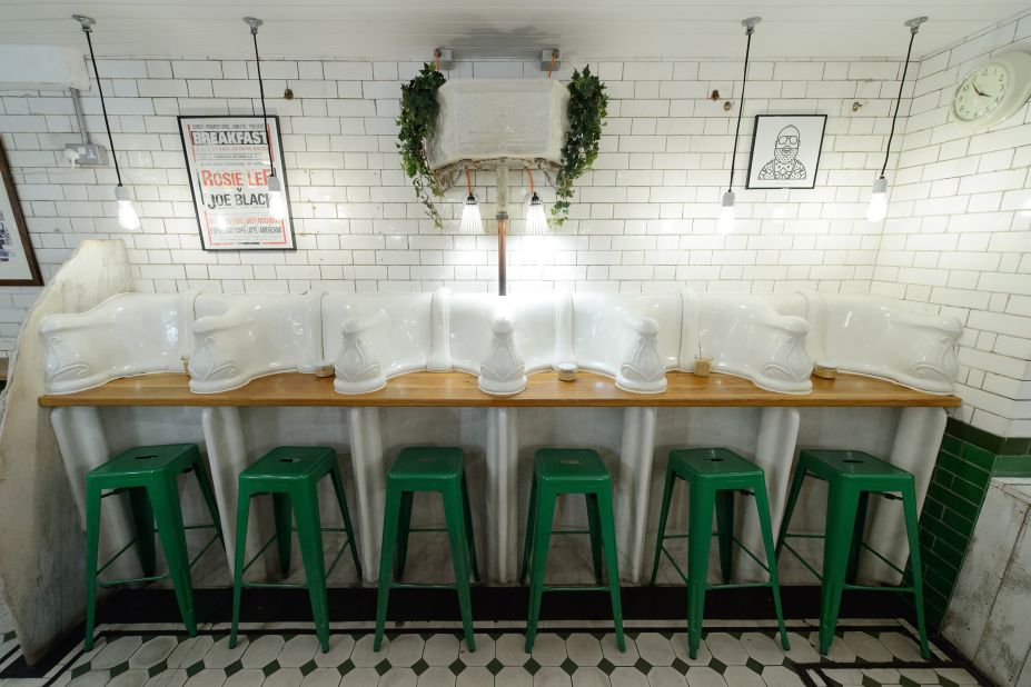 Former public toilets in London are being reinvented as coffee shops, wine bars, pizza joints -- and even homes. Here, original urinals and cisterns are pictured in Attendant, a former loo turned hip Central London coffee shop.