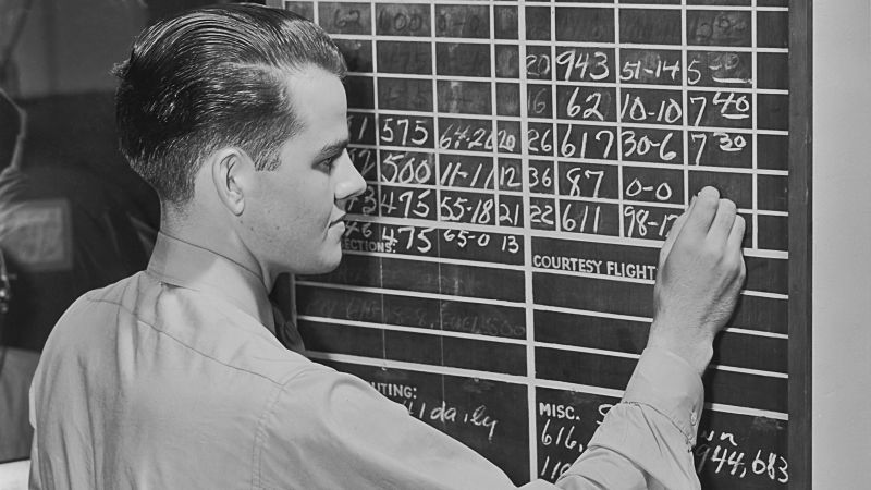 When Nash first began flying in the '50s, all flight schedules were chalked up on a blackboard, and manuals and regulations came in book form. Pictured: An archive image of incoming and outgoing flights being chalked up circa 1945.  