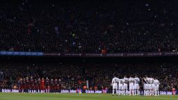 Barcelona and Real Madrid team players stand before the Spanish league "Clasico" football match FC Barcelona vs Real Madrid CF at the Camp Nou stadium in Barcelona on April 2, 2016. / AFP / JOSEP LAGO        (Photo credit should read JOSEP LAGO/AFP/Getty Images)
