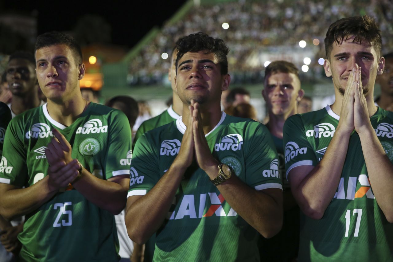 Players from the Brazilian soccer team Chapecoense mourn their fallen teammates during a tribute at the team's stadium in Chapeco, Brazil, on Wednesday, November 30. A charter airplane carrying 77 people, including most players from Chapecoense, crashed near Rionegro, Colombia, on Monday, November 28. Seventy-one people were killed, officials said. Six survived: three players, two crew members and one journalist.