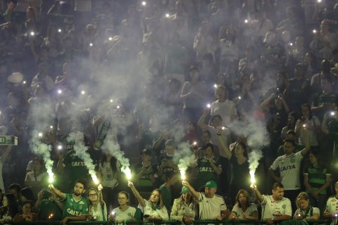 Chapecoense supporters light flares during the stadium tribute on November 30. The soccer club, which has risen in the ranks in Brazilian soccer and now has a devoted national fan base, was set to play in the first leg of the South American Cup finals on Wednesday.