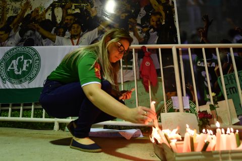 Fans in Chapeco light candles on November 30.