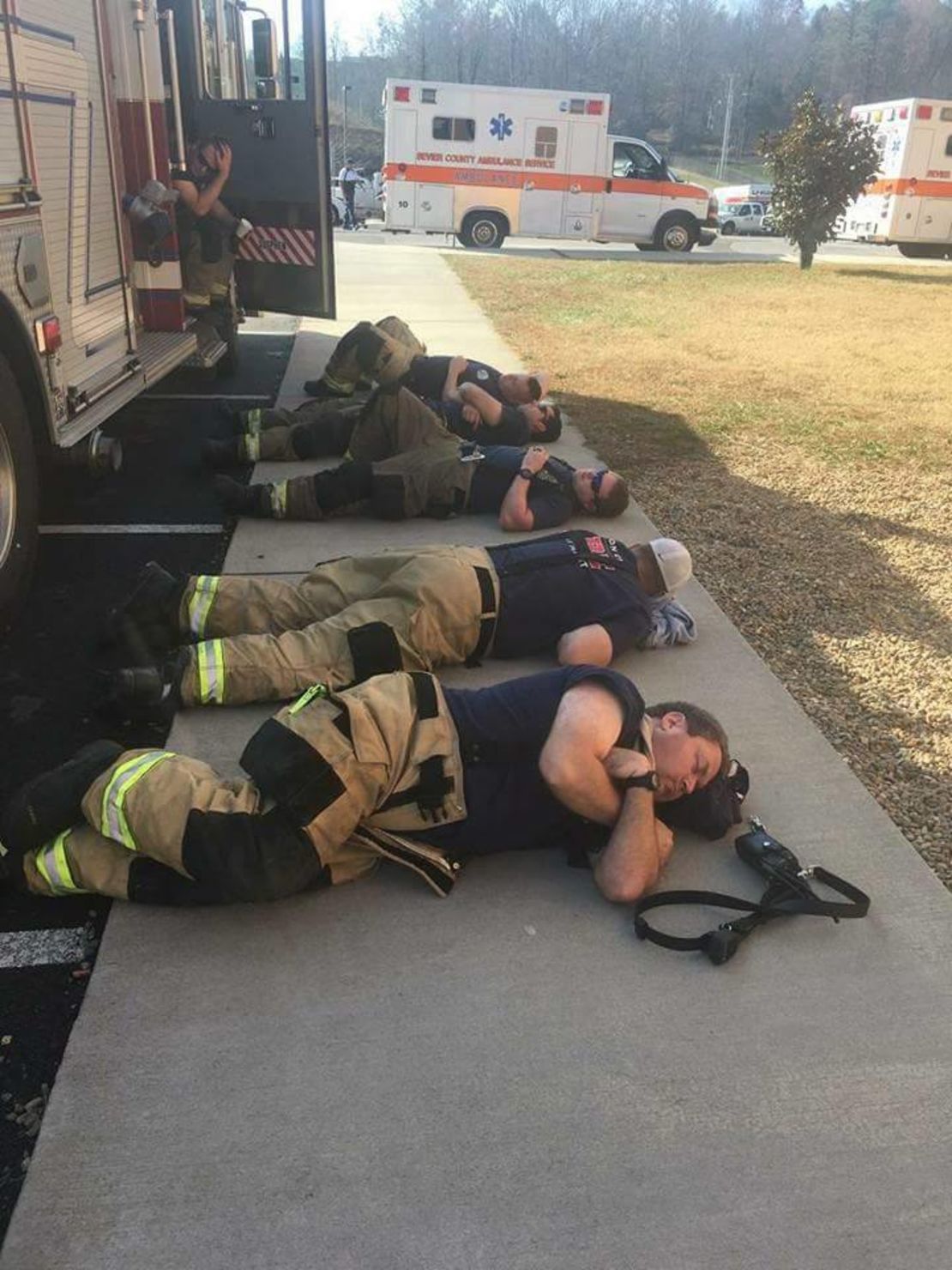 Firefighters from the Johnson City Professional Firefighters Association L-1791 rest after 36 hours of battling the fires around Gatlinburg, TN