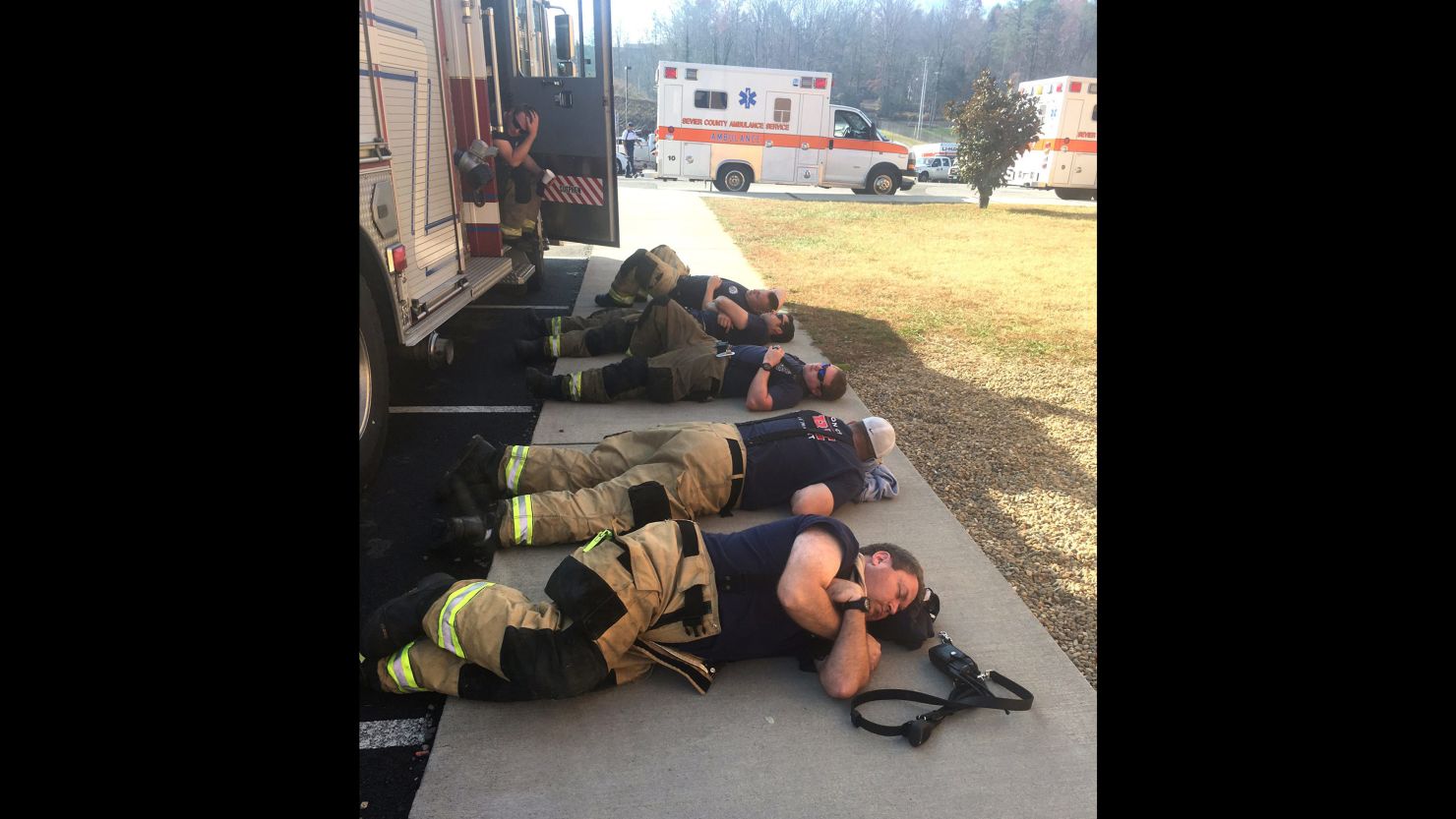 After spending thirty hours fighting the wildfires in Gatlinburg, these firefighters took a much deserved break right on the sidewalk.