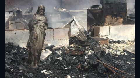 A statue of Jesus was the only thing left standing after the wildfires swept through this house in Sevier County, Tennessee.