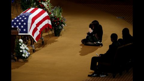 <strong>June 21:</strong> Lucy Lugo, wife of fallen police officer Endy Ekpanya, comforts their son, Julian, during his funeral service in Houston. Ekpanya, a police officer in Pearland, Texas, died after his patrol car was struck by another vehicle.