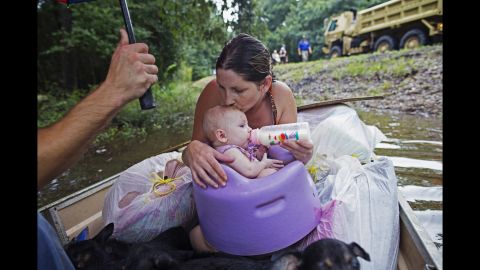 <strong>August 14:</strong> Danielle Blount and her 3-month-old baby, Ember, wait to be rescued by the Louisiana Army National Guard near Walker, Louisiana. More than 30,000 people <a href="http://www.cnn.com/2016/08/13/us/gallery/louisiana-flooding/index.html" target="_blank">were rescued in southern Louisiana</a> after heavy rains caused flooding.